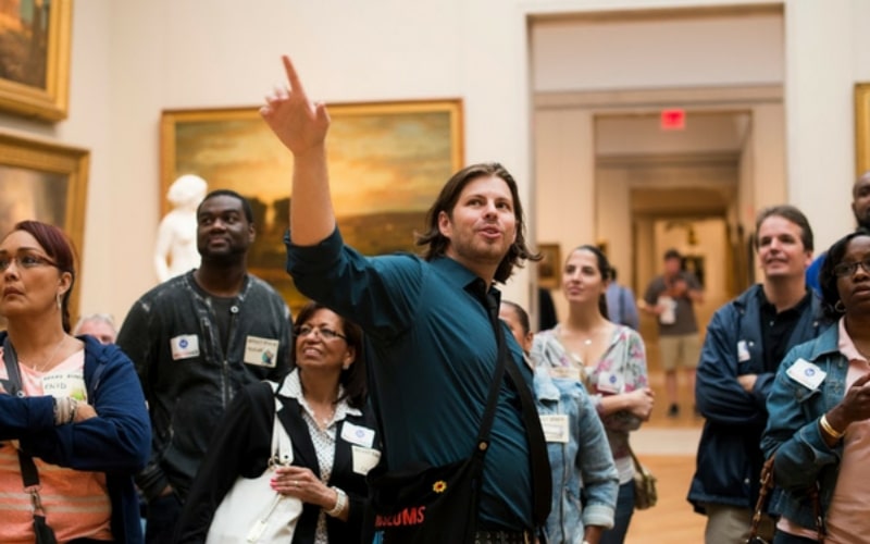 Image of a Museum Hack tour leader leading a group